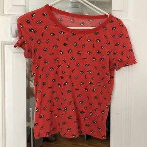 Cute and funky orange T-shirt with eyeball print